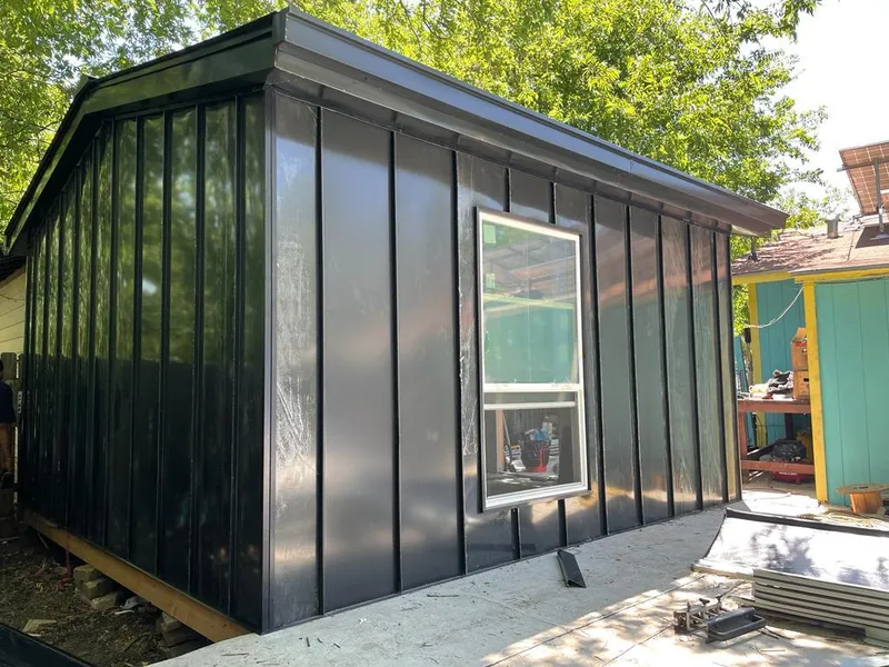 Black standing seam metal wall panels for Roof Inspection in Phelan